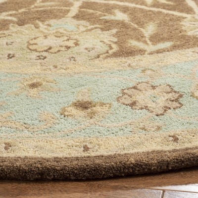 Handmade Tufted Ivory and Brown Wool Round Rug