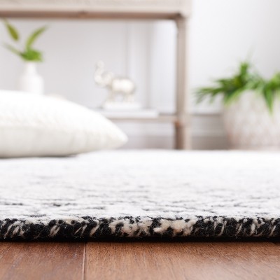 Black and Ivory Geometric Wool 3' x 5' Area Rug