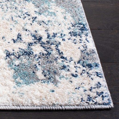 Ivory and Blue Abstract Synthetic Area Rug, 3' x 5'