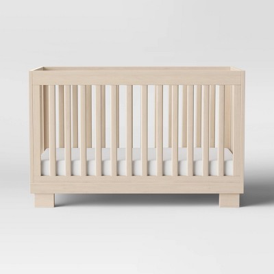 black and natural wood crib