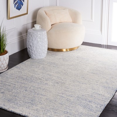 Blue and Ivory Floral Hand-Tufted Wool Area Rug, 5' x 8'