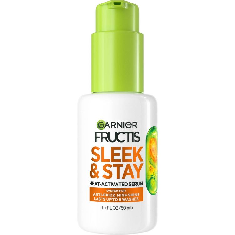 White bottle of Garnier Fructis Sleek & Stay Heat-Activated Serum with a green pump, labeled for anti-frizz and high shine, 1.7 fl oz (50 ml).