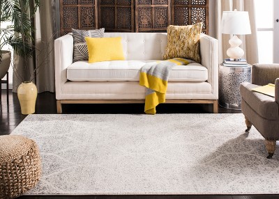 Ivory and Silver Geometric 8' x 10' Synthetic Area Rug