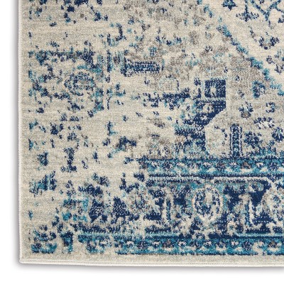 Ivory and Light Blue Synthetic 6' x 9' Easy Care Rug