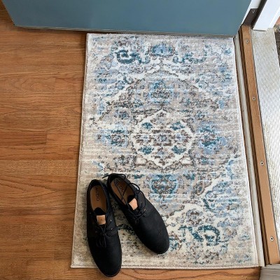 Cream and Blue 9' x 12' Oriental Synthetic Area Rug