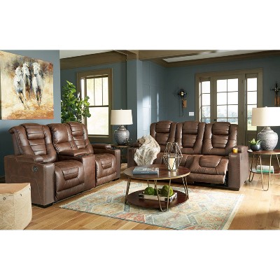 Brown Tufted Faux Leather Reclining Sofa with Storage and Cup Holder