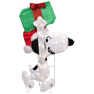 Peanuts Christmas 32" Prelit Snoopy Holding Present Outdoor Decoration - Clear Lights - 1 of 4