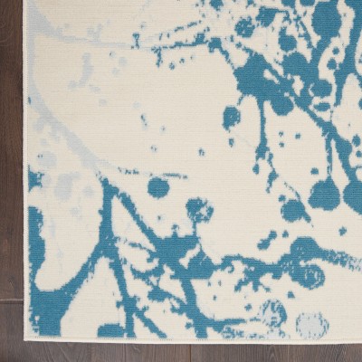 Ivory and Blue Abstract Synthetic 4' x 6' Easy-Care Area Rug