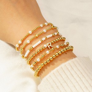Turandoss 6PCS Gold Initial Bracelet for Women Girls - Stacked Beaded Bracelets for Kids, Layered Letter Pearl Bracelet Set for Girls, Christmas Gifts - 1 of 4