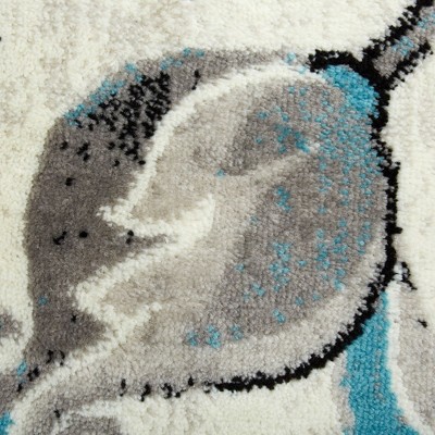 Ivory Floral Tufted 64" Synthetic Easy-Care Area Rug