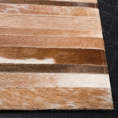 Handwoven Tan and Ivory Geometric Cowhide Area Rug