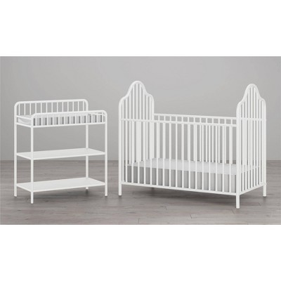 white crib and changing table