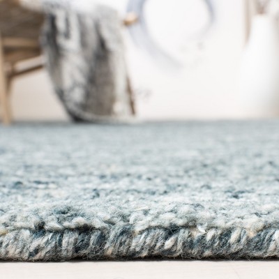 Handmade Himalaya Tufted Blue Wool Rectangular Rug - 5' x 8'