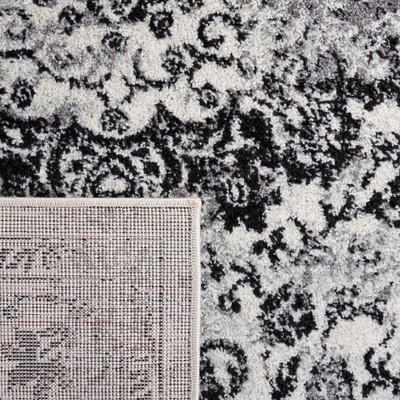 Ivory and Black Square Synthetic Area Rug