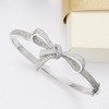Ross-Simons 0.15 ct. t.w. Diamond Bow Bangle Bracelet in Sterling Silver - 4 of 4