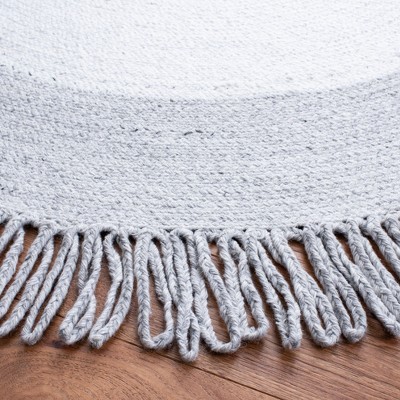 Handmade Round Ivory Synthetic Area Rug, 7' Diameter