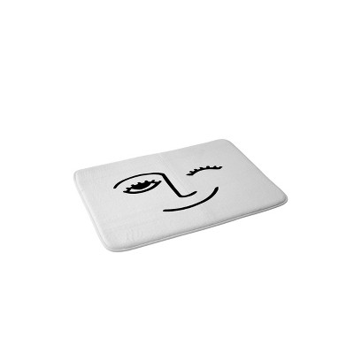 Mambo Art Studio Wink Face Bath Mat Black/White - Deny Designs