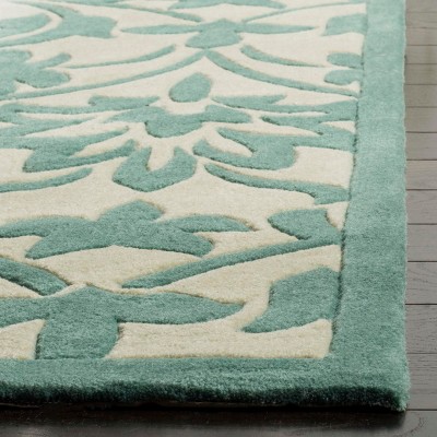 Ivory and Light Blue Hand-Tufted Synthetic 4' x 6' Area Rug