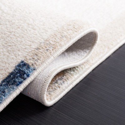 Ivory and Blue Rust Round Synthetic Area Rug, 6'7"