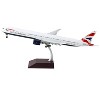 Boeing 777-300ER Commercial Aircraft w/Flaps Down White w/Striped Tail 1/200 Diecast Model Airplane by GeminiJets - 2 of 3