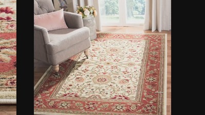 Ivory Tufted Handmade 6' x 9' Rectangular Synthetic Rug