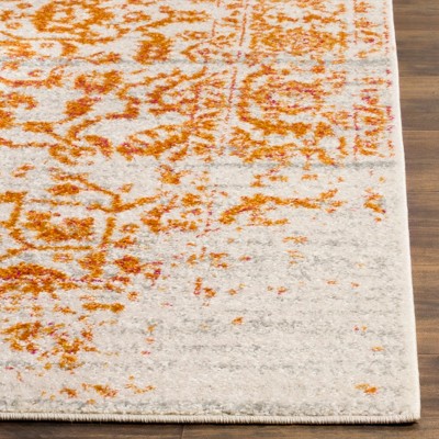 Cream and Orange 3' x 5' Synthetic Area Rug