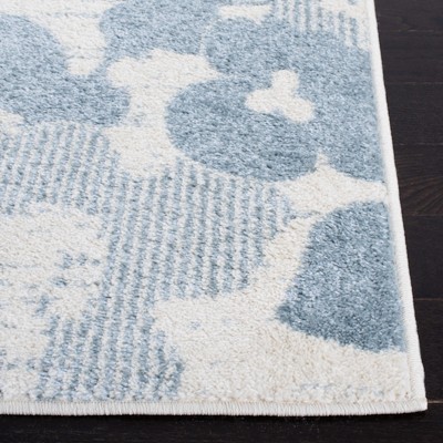 Ivory and Blue Floral Synthetic 6' x 9' Area Rug