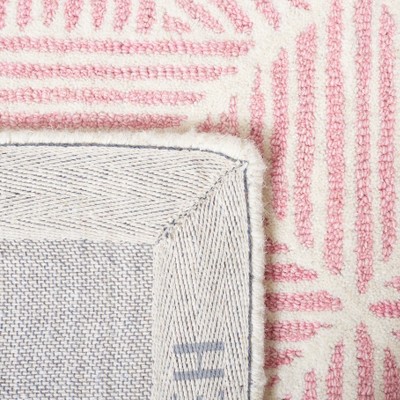 Handmade Pink and Ivory Abstract Wool Area Rug