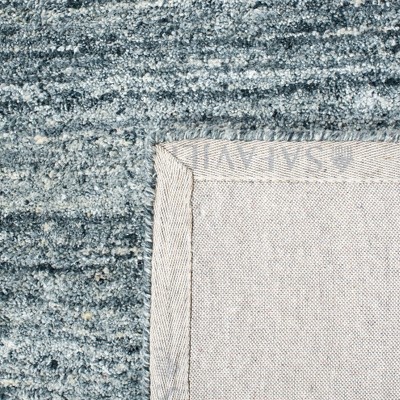 Handmade Himalaya Tufted Blue Wool Rectangular Rug - 5' x 8'