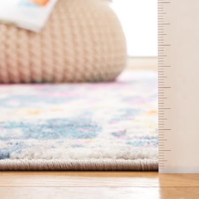 Ivory and Blue Abstract Synthetic Area Rug, 6' x 9'