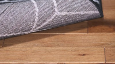 Braided Round Black and Ivory Synthetic Rug, 4' x 6'