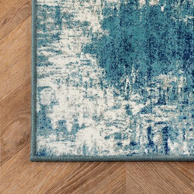 Light Blue Abstract 8' x 10' Stain-Resistant Synthetic Rug