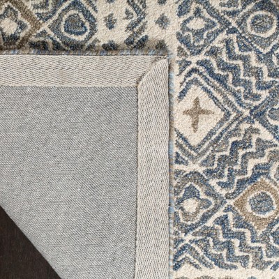 Ivory and Blue Handmade Wool Tufted Area Rug, 5' x 8'