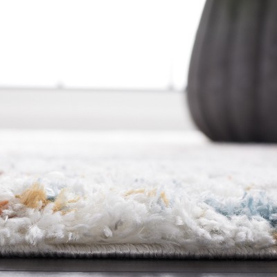 Ivory and Blue Synthetic Shag Area Rug, 7' Square