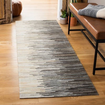 Handmade Ivory Geometric Cowhide Rug - 2' 3" x 7'