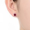 Elegant square stud earring featuring a central cubic zirconia stone surrounded by dazzling accents - 2 of 2