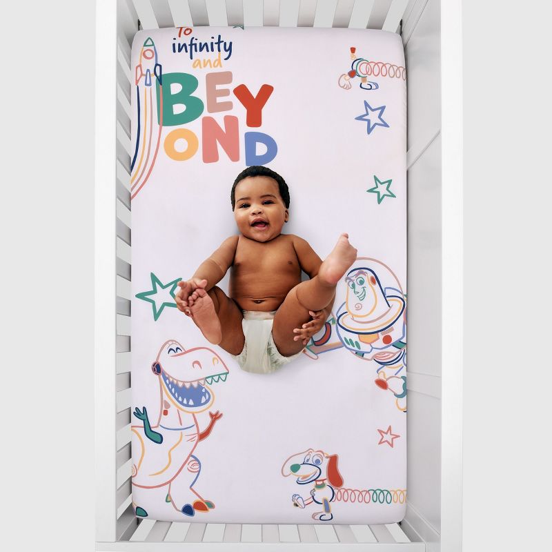 Disney Toy Story Green, Red, Blue and White "To Infinity and Beyond" Color Crazy Nursery Photo Op Fitted Crib Sheet, 4 of 5