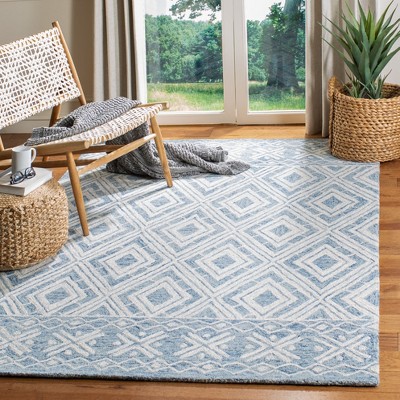 Blue and Ivory Handmade Wool Tufted Area Rug, 5' x 8'