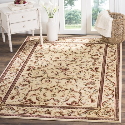 Ivory Floral Bordered Synthetic Area Rug 5'3" x 7'6"