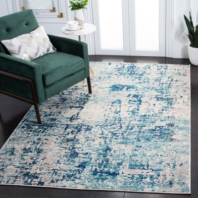 Ivory and Turquoise Abstract 8' x 10' Synthetic Area Rug