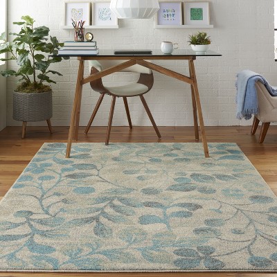 Ivory and Turquoise Floral Synthetic 6' x 9' Area Rug