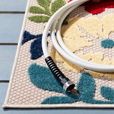 Ivory and Orange Floral Synthetic Outdoor Rug, 26" x 9'