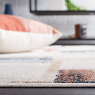 Ivory and Blue Rust Round Synthetic Area Rug, 6'7"
