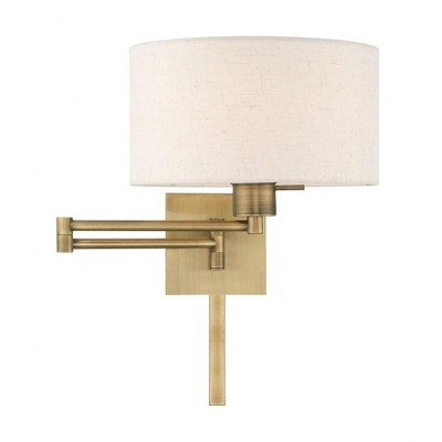 Antique Brass Swing Arm Wall Lamp with Oatmeal Shade