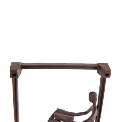 Dark Brown Iron Man Reading on Window Sill Sculpture