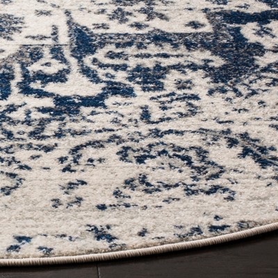 Ivory and Navy Synthetic 3' Round Reversible Area Rug
