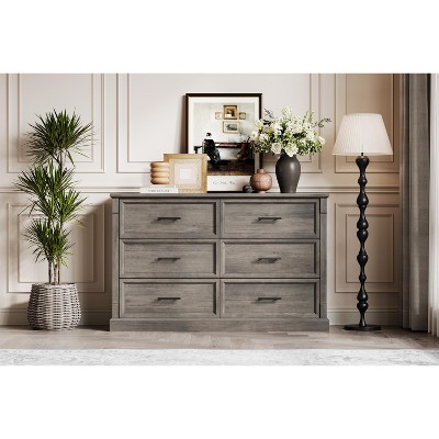 Grey 6-drawer dresser in a living room setting