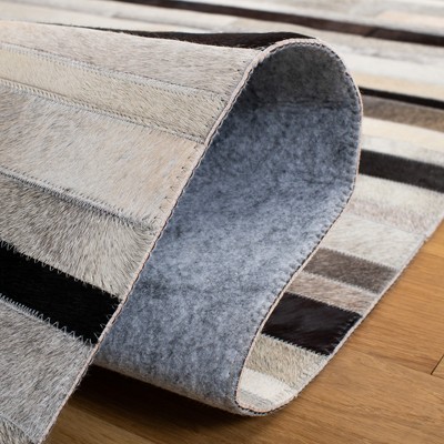 Handmade Black and Ivory Geometric Cowhide Area Rug
