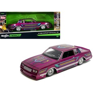 1986 Chevrolet Monte Carlo SS Lowrider Pink Metallic with Graphics "Lowriders" Series 1/24 Diecast Model Car by Maisto - 1 of 3