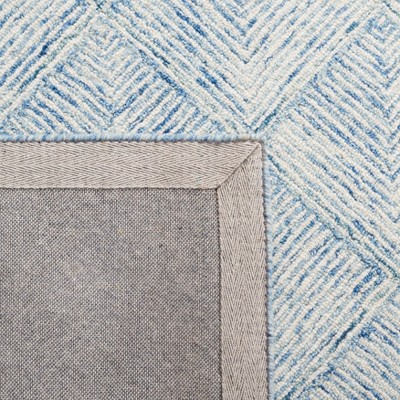 Handmade Blue and Ivory Wool Abstract Tufted Area Rug 5' x 8'